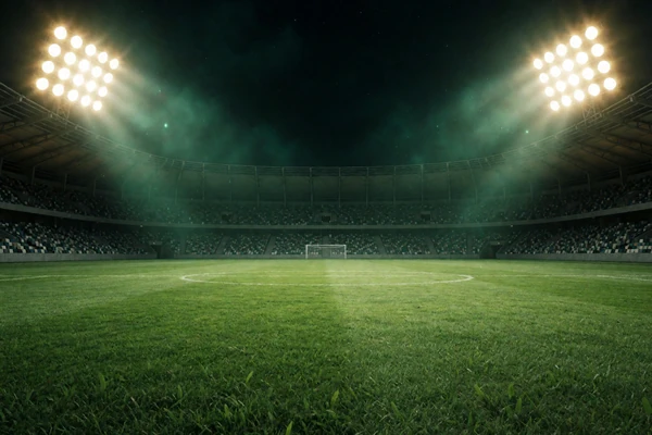 Stadion-Flutlichter beleuchten gr&uuml;nen Fu&szlig;ballplatz bei Nacht &ndash; Sportwetten im WildRobin Casino